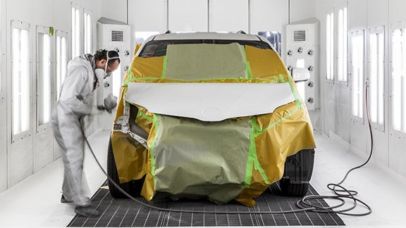 Collision Center Technician Painting a Vehicle | Hamilton Toyota in Clovis NM