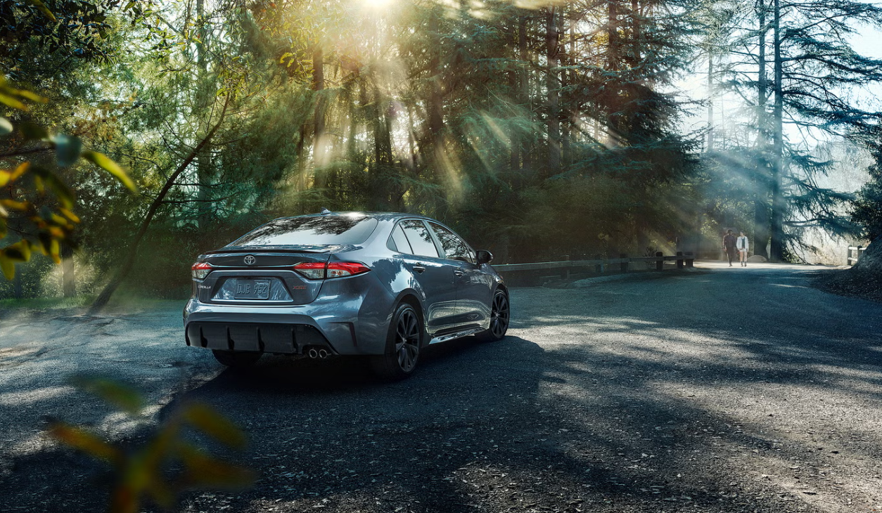 Toyota Corolla parked on a city street, showcasing its sleek design and modern features.